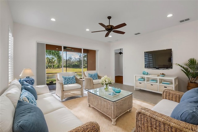 living room with ceiling fan and light tile patterned floors