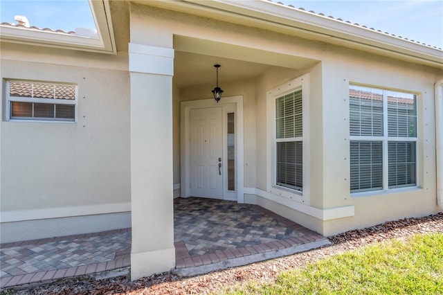 entrance to property featuring a patio