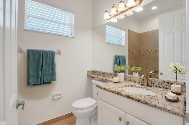 bathroom with vanity, tile patterned floors, and toilet