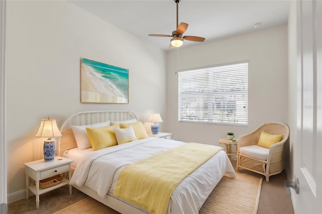 bedroom with ceiling fan and carpet flooring