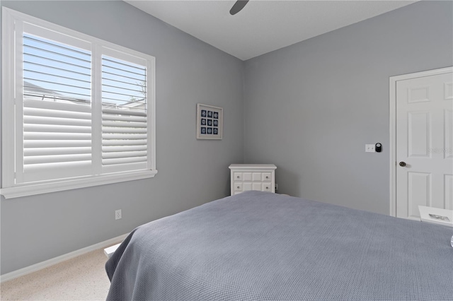 bedroom featuring ceiling fan and carpet