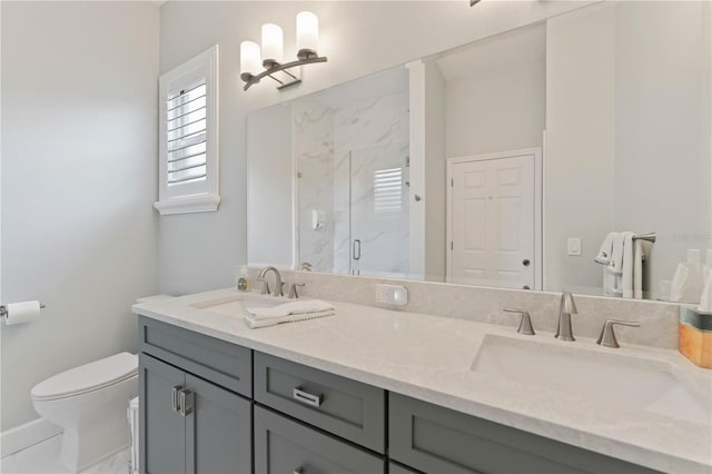 bathroom with toilet, a shower with door, and vanity