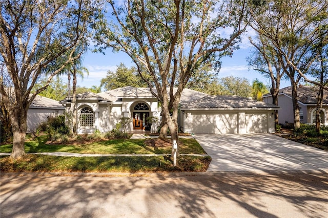 ranch-style home featuring a garage