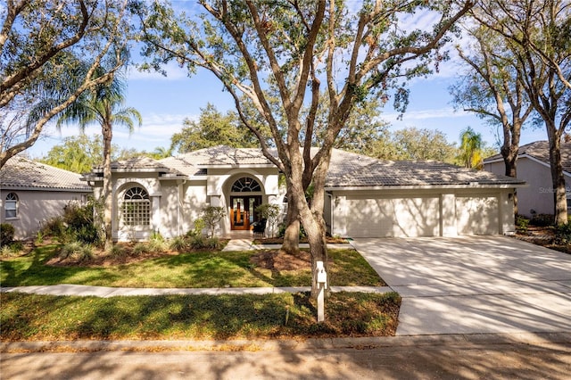 view of front of property with a garage