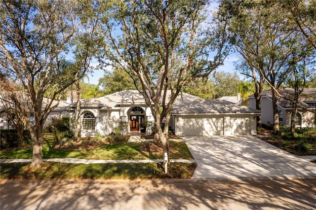 ranch-style home with a garage