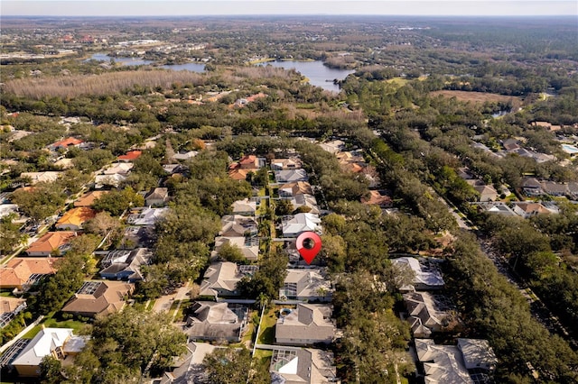 bird's eye view featuring a water view and a residential view