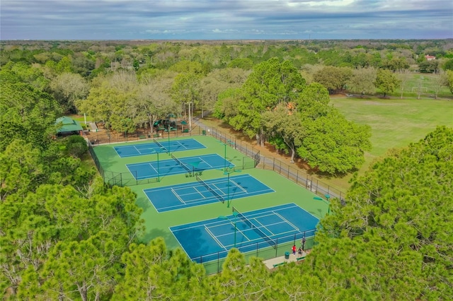 drone / aerial view featuring a wooded view