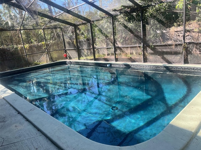 view of pool with a lanai