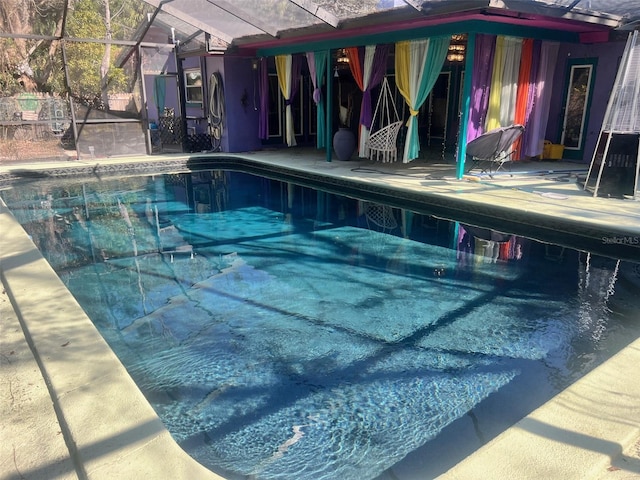 view of pool with a lanai