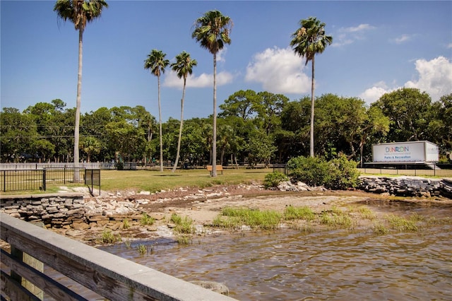 surrounding community with a water view