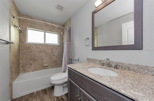 full bathroom with shower / tub combo with curtain, vanity, toilet, and wood-type flooring