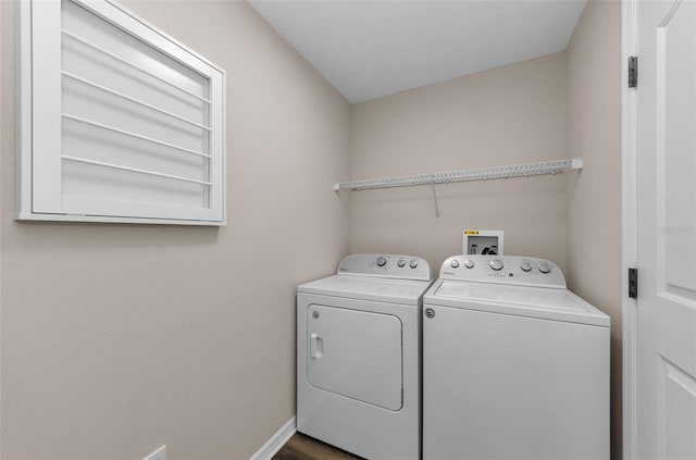 washroom featuring washer and clothes dryer