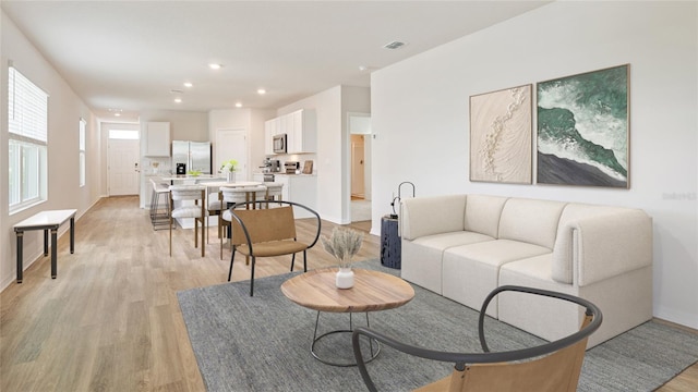 living room with light hardwood / wood-style flooring