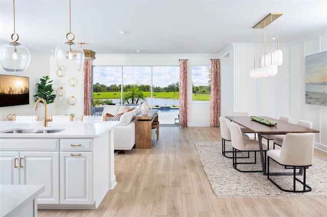 interior space with sink and light hardwood / wood-style flooring