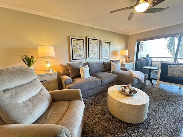 living room with ceiling fan, hardwood / wood-style floors, and crown molding