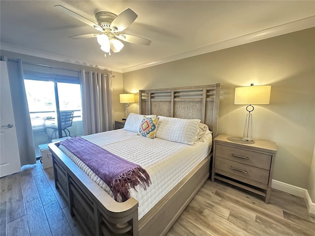 bedroom featuring ceiling fan, ornamental molding, and light wood-type flooring