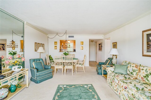 living room with carpet floors, crown molding, and a notable chandelier