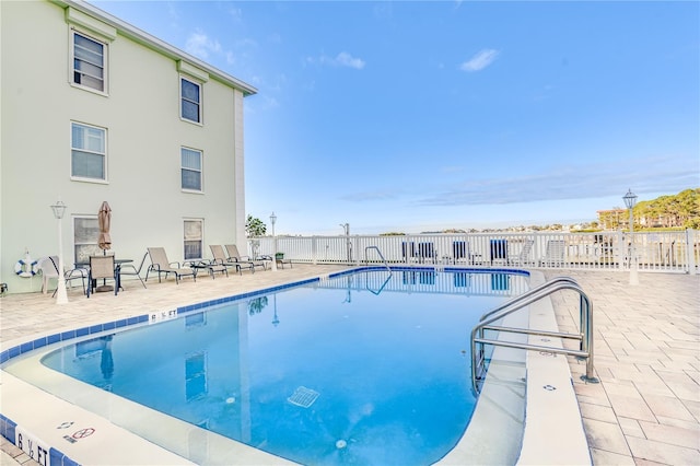 view of pool featuring a patio