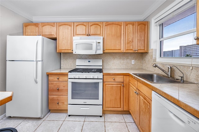 kitchen featuring sink, white appliances, crown molding, and tasteful backsplash