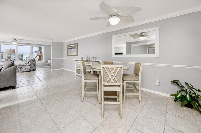 tiled dining area featuring ornamental molding