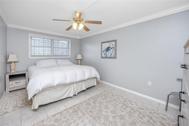 tiled bedroom with ceiling fan and crown molding