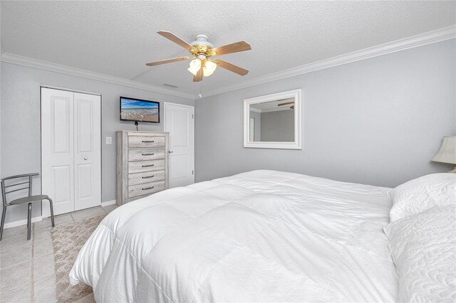 bedroom with ceiling fan, light tile patterned flooring, crown molding, and a textured ceiling