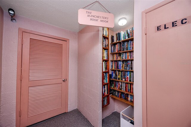 corridor with a textured ceiling