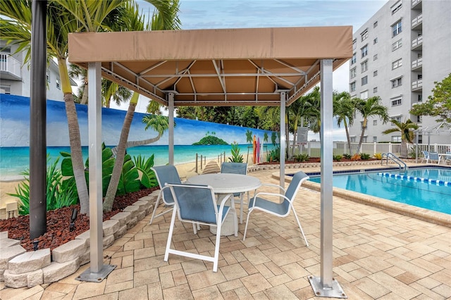 view of swimming pool with a gazebo and a patio area