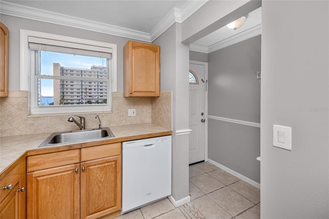 kitchen with tile countertops, dishwasher, backsplash, ornamental molding, and sink