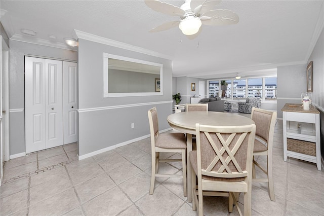 dining area with ceiling fan, ornamental molding, light tile patterned flooring, and a textured ceiling