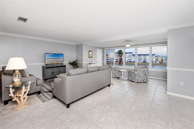 living room featuring light tile patterned flooring, ceiling fan, and crown molding