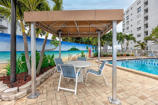 view of pool featuring a patio area and a gazebo