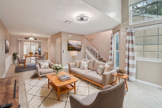 tiled living room with plenty of natural light