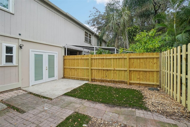 view of yard with a patio area and french doors