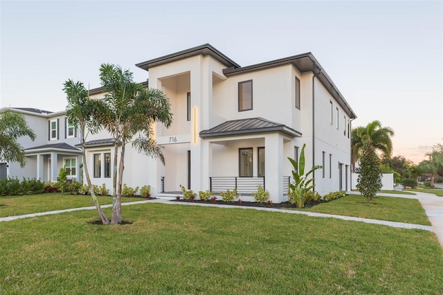 view of front of home with a lawn