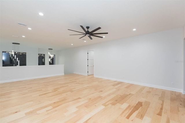 unfurnished room featuring ceiling fan and light wood-type flooring