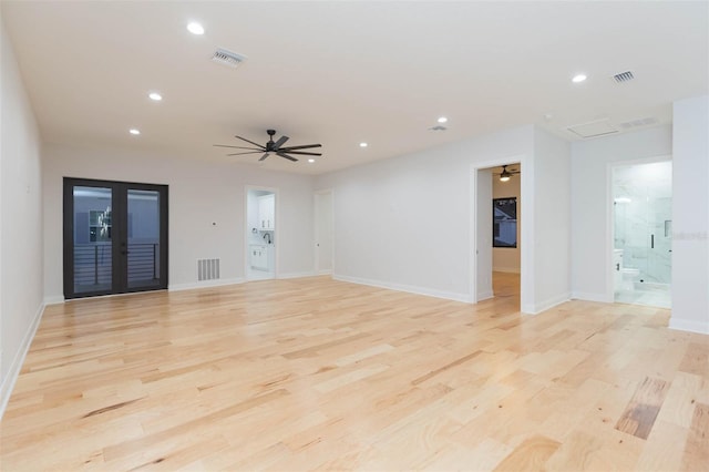 spare room featuring ceiling fan and light wood-type flooring