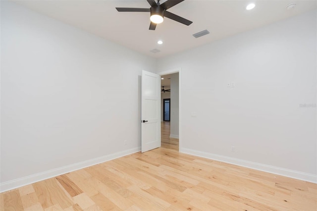 unfurnished room featuring ceiling fan and light hardwood / wood-style floors