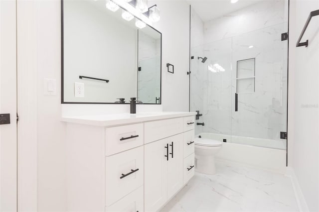 full bathroom featuring toilet, bath / shower combo with glass door, and vanity