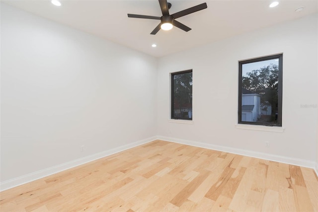 unfurnished room featuring light hardwood / wood-style floors and ceiling fan