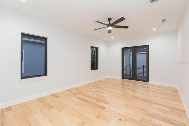 spare room featuring ceiling fan and light hardwood / wood-style flooring