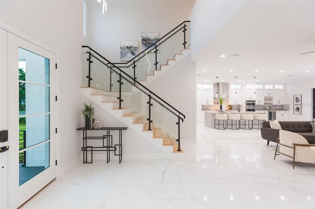 716 S Lois Ave, Tampa, FL 33609 - entrance foyer with stairs, marble tiled floors, recessed lighting, and baseboards