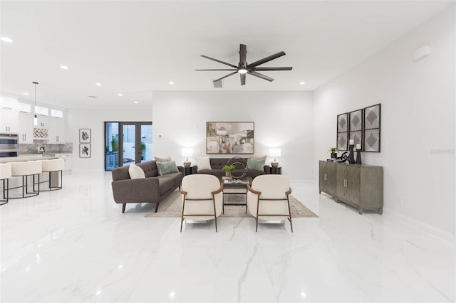 716 S Lois Ave, Tampa, FL 33609 - living area featuring light marble finish floors, recessed lighting, baseboards, and a ceiling fan