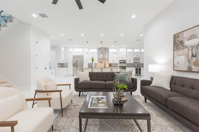 716 S Lois Ave, Tampa, FL 33609 - living room with stairway, recessed lighting, a ceiling fan, and beverage cooler