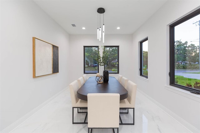 716 S Lois Ave, Tampa, FL 33609 - dining room featuring light marble finish floors, recessed lighting, and baseboards
