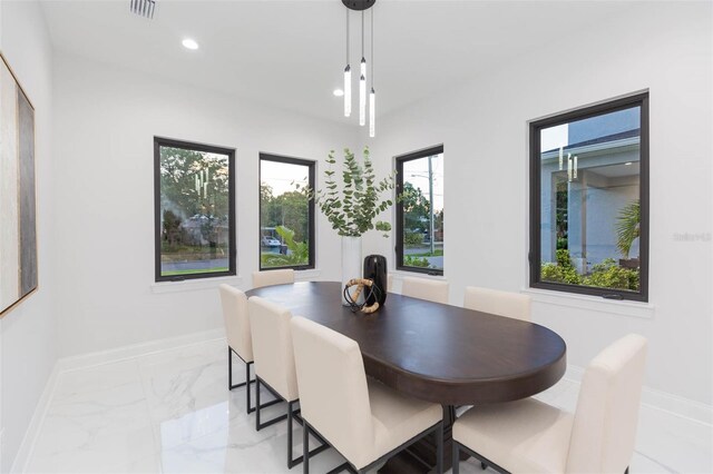 716 S Lois Ave, Tampa, FL 33609 - dining space featuring light marble finish flooring, baseboards, and recessed lighting