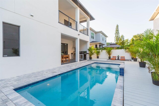716 S Lois Ave, Tampa, FL 33609 - view of swimming pool featuring an outdoor kitchen and a patio area