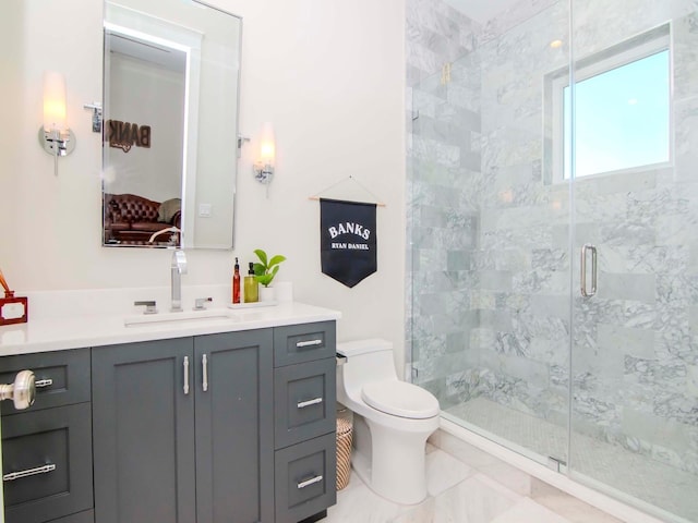 bathroom with toilet, tile patterned flooring, a shower with shower door, and vanity