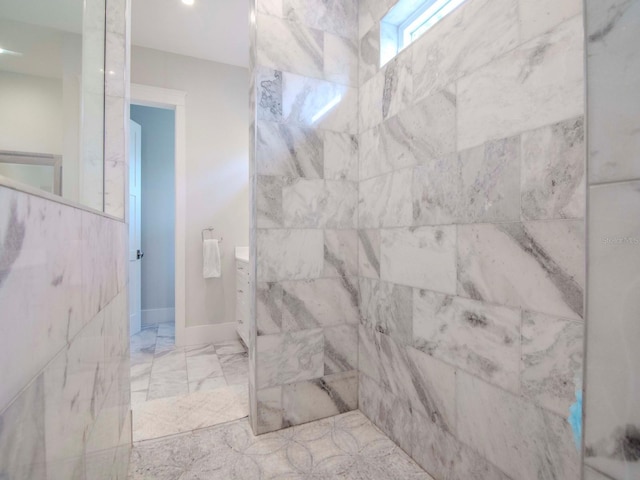 bathroom featuring vanity and a shower