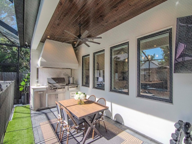 view of patio / terrace with ceiling fan, exterior kitchen, and area for grilling